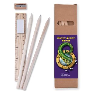 A stationery set featuring three pencils, a ruler, a sharpener, and a cardboard box with a logo. Primarily in light wood tones.
