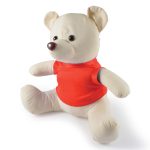 A plush toy bear with a cream-colored body and a red shirt, featuring round ears and a stitched face.