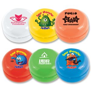 A collection of colorful yo-yos in orange, green, yellow, and white, featuring various character designs and logos.