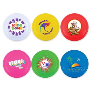 A set of colorful frisbees in white, yellow, red, blue, and green, each featuring different logos and designs.