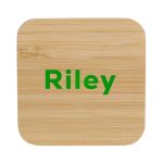 A bamboo wireless charger with rounded corners and a green logo, featuring a natural wood finish.