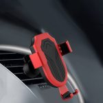 A red wireless car charger mounted on a vehicle's air vent, featuring a sleek design and black accents.