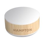 A round, wooden-textured wireless charging speaker in cream and light beige, featuring a brand logo.