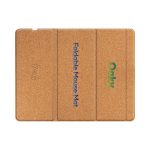 A foldable wireless charging mouse pad in a natural cork finish. Features branding and a wireless charging symbol.