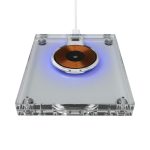 A clear acrylic wireless charger with a circular copper charging pad and blue ambient lighting.