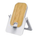 A wireless charging stand in white with a bamboo top, featuring a logo on the surface.