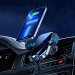 A fast wireless car charger in black, with a smartphone displaying a charging icon, set in a car interior.