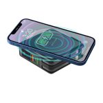 A black magnetic travel charger with a smartphone on top, displaying a wireless charging graphic.