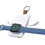 A white magnetic power bank with a brown leather strap, with a blue smartwatch attached for charging.