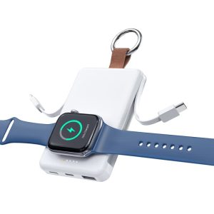 A white magnetic power bank with a brown leather strap, with a blue smartwatch attached for charging.