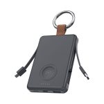 A black power bank with a key ring, featuring built-in charging cables and a circular wireless charging pad.