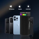 A wireless speaker in black with multicoloured lights beside three smartphones in dark hues. The speaker has a branded logo.