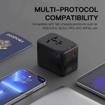 A travel adaptor in black with multiple ports, set against a backdrop of a passport and electronic devices.