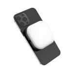 A white magnetic LED selfie light attached to a black smartphone. The product has a logo on its surface.