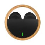 Eco-friendly black earbuds housed in a circular bamboo case with a green indicator light.
