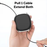 A retractable charging data cable in a sleek black casing, held in a hand, with one cable extended.