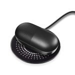 A black wireless charger with a textured surface, featuring a rounded design and a cable connector.