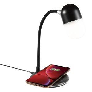 A black wireless charging sound lamp with a flexible neck beside a smartphone on a circular charging pad.