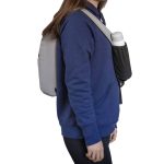 A grey Sling Eco Bag worn over a navy hoodie, featuring a side pouch for a drink bottle.