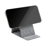 A wireless charger in grey fabric, designed to hold a smartphone upright for convenient charging.