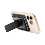 A phone with a black Wally Stand attached to its back, featuring a flat, extendable grip.