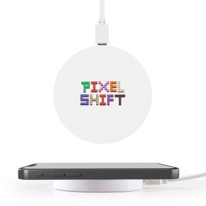 A round white wireless charger with a logo on top, positioned near a smartphone on a white surface.