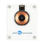 A crystal wireless charger with a circular copper charging area and a clear casing, featuring a logo.