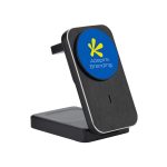 A wireless charger with a sleek black design and a circular blue logo on the front, featuring a branding element.