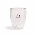 A double-walled glass cup with a transparent design and a logo featuring a mountain and palm tree.