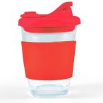 A reusable coffee cup with a clear body and a vibrant red snap lid, featuring a matching silicone sleeve for grip.