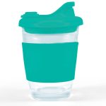 A reusable coffee cup with a clear body and a teal silicone sleeve and snap lid.