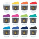A collection of reusable coffee cups in various colors with silicone lids and RPET bands, featuring logos.