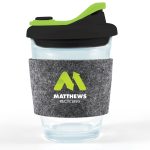 A reusable coffee cup with a clear body, black snap lid, and grey RPET band featuring a green logo.