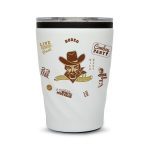 A reusable coffee cup in white featuring a cowboy graphic and a dark lid, with various decorative elements.
