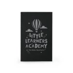 A black notebook featuring a hot air balloon design and the text "Little Learners Academy".