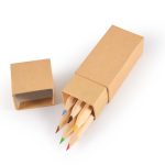 A cardboard box containing a set of coloured pencils in blue, green, yellow, red, and orange.