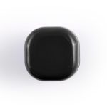 A black cube lip balm with rounded edges, featuring a branding logo on the surface.