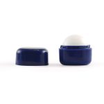 A navy blue cube lip balm with a smooth, round top and a matching lid. It features a logo.