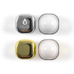 Two sets of square lip balm containers, one silver and black, one gold and white, with a logo on the silver container.