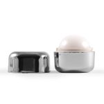 A Ritz Cube Lip Balm in a sleek silver container, with the lid removed to reveal the lip balm.
