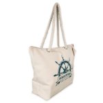 A cream canvas tote bag with a nautical design and rope handles. Features a logo on the front.