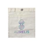 A cream canvas bag featuring a decorative logo in pastel colours on the front.