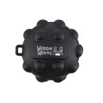 A black, round toy featuring raised bumps and a logo, designed with playful character details.