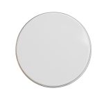 A petite candle in a smooth white tin container.