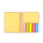 A set of sticky notes in yellow and pastel colors, arranged in a bamboo holder.