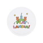 A round white game board featuring a castle design and colourful text spelling "PLAYLANDIA!" with decorative stars.