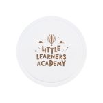 A round white promotional item featuring the text "Little Learners Academy" in brown with a hot air balloon and stars.