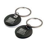 A circular stainless steel keytag in black and white with a metal keyring. Features a logo on the surface.