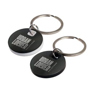 A circular stainless steel keytag in black and white with a metal keyring. Features a logo on the surface.