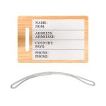 A bamboo luggage tag featuring a blank white area for personal information and a clear attachment loop.